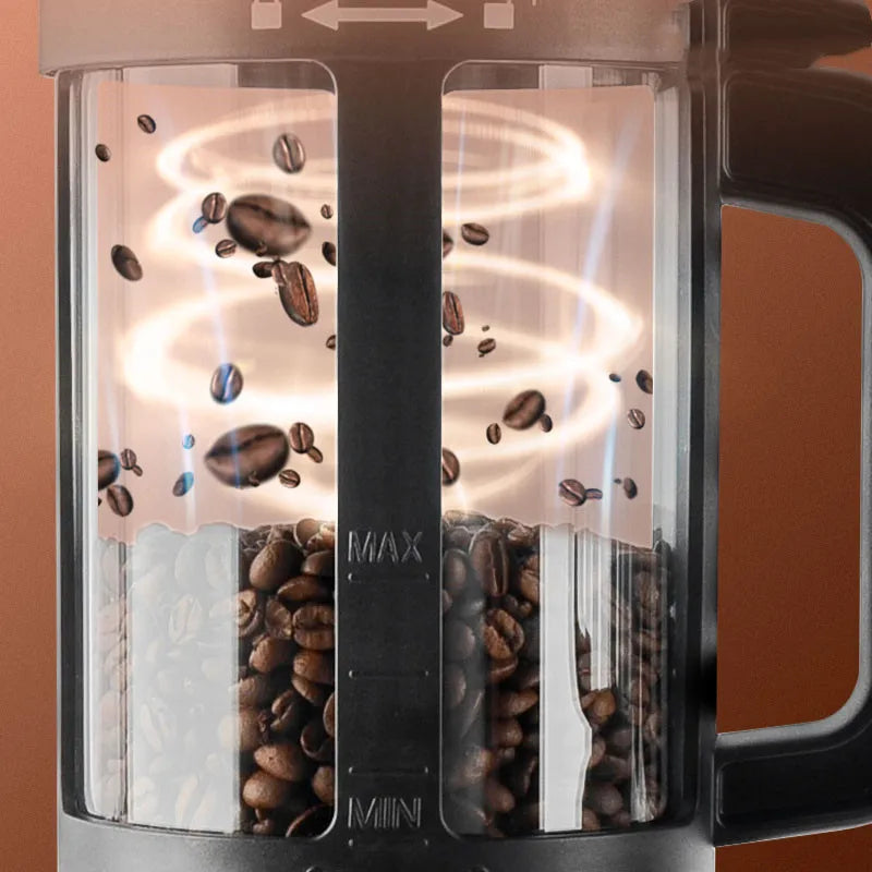 Coffee My Cup: Close-up of a coffee roaster with coffee beans inside, on a brown background.