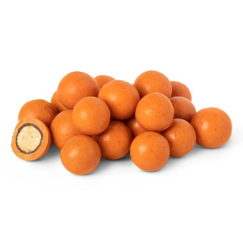 Coffee My Cup Sweet Treats Collection: Pumpkin Spice Malted Milk Balls: Pile of orange candy balls on a white background