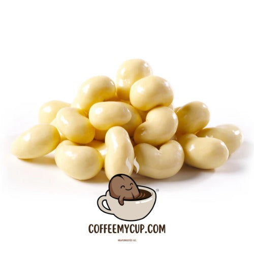 White chocolate chips with a small cartoon character in a coffee cup and 'COFFEEMYCUP.COM' text on a white background.  Coffee My Cup Sweet Treats Collection: White Chocolate Latte Cashews – 4oz Bag