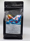 Coffee My Cup: Island Fun Coffee, Black coffee packaging with colorful label featuring a bear and text on a white background