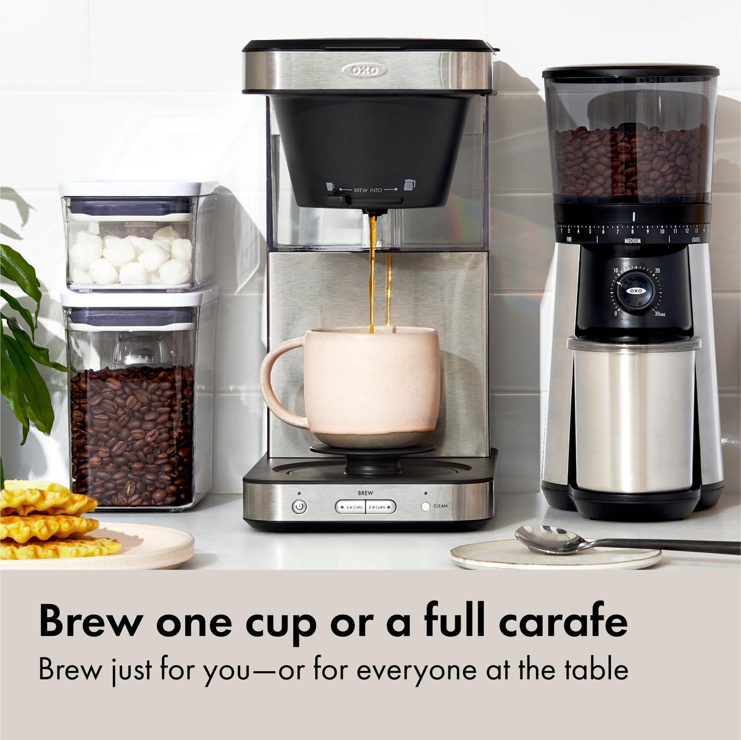 Coffee My Cup: Coffee maker with a grinder and coffee beans on a kitchen counter.
