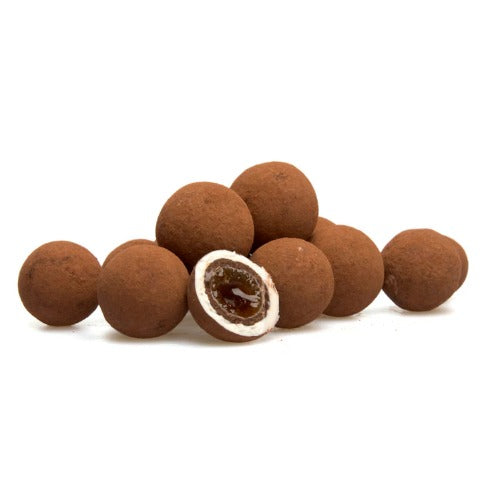 Coffee My Cup Sweet Treats Collection: Cappuccino Coco Delight: Chocolate truffles with one cut open to reveal a filling on a white background