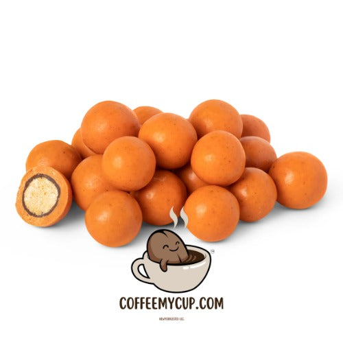 Coffee My Cup Sweet Treats Collection: Pumpkin Spice Malted Milk Balls: Pile of orange candy balls with a cartoon character and website text on a white background