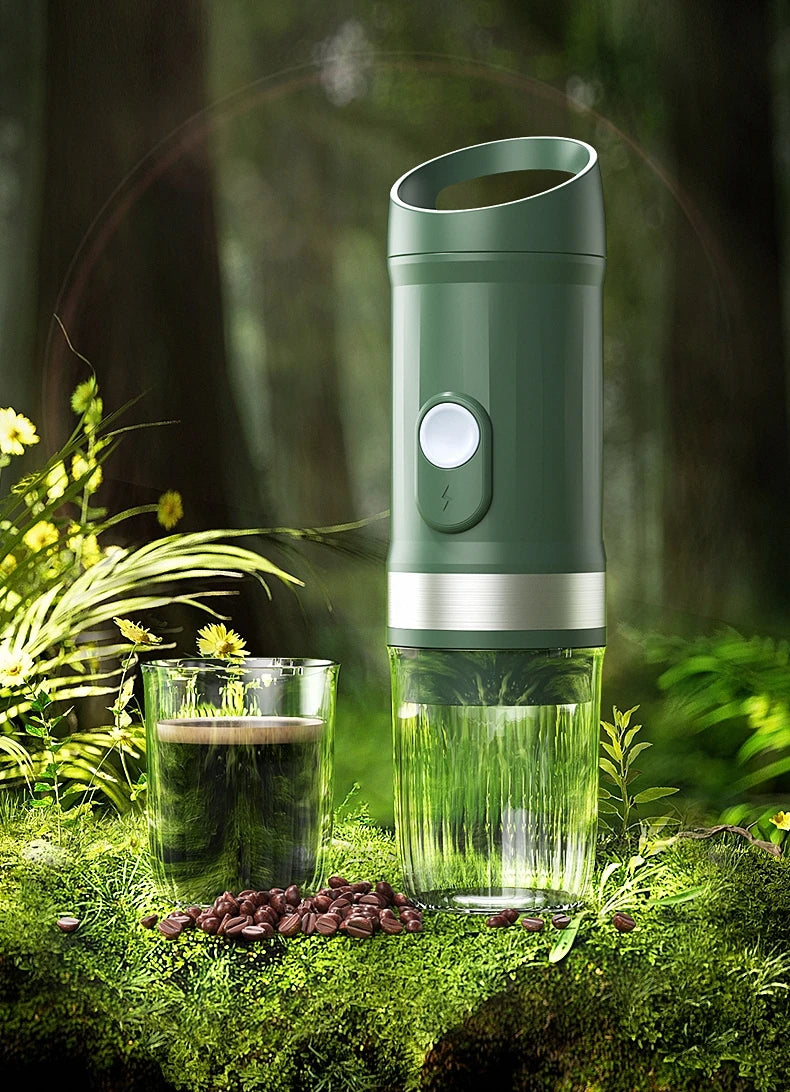 Coffee My Cup: Green portable coffee maker on a grassy background with a glass of coffee and coffee beans.