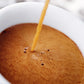Coffee My Cup: Hot liquid being poured into a white cup filled with coffee.