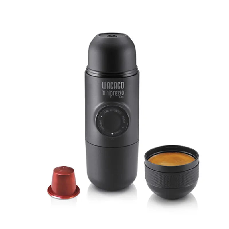 Coffee My Cup: Black Wacaco minipresso portable espresso maker with a red cap and black cup on a white background
