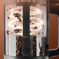 Coffee My Cup: Close-up of a coffee roaster with coffee beans inside, on a brown background.