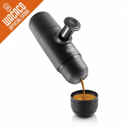Coffee My Cup: Black portable espresso maker pouring coffee into a small black cup on a white background, with Wacaco branding.