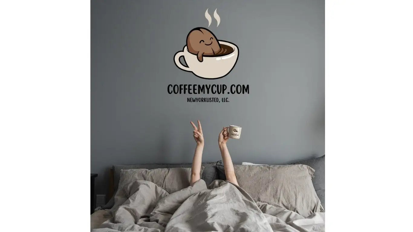 Person holding a coffee cup with a cartoon coffee cup design above, featuring 'COFFEEMYCUP.COM' on a gray wall.