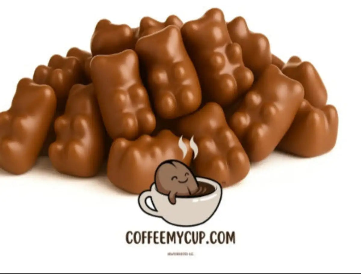 Coffee My Cup Sweet Treats Collection: Milk Chocolaté Gummy Bears du Lait: Chocolate bear candies with a small cartoon bear in a cup and 'COFFEEMYCUP.COM' text on a white background.
